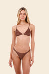 Woman wearing a brown bikini set 
