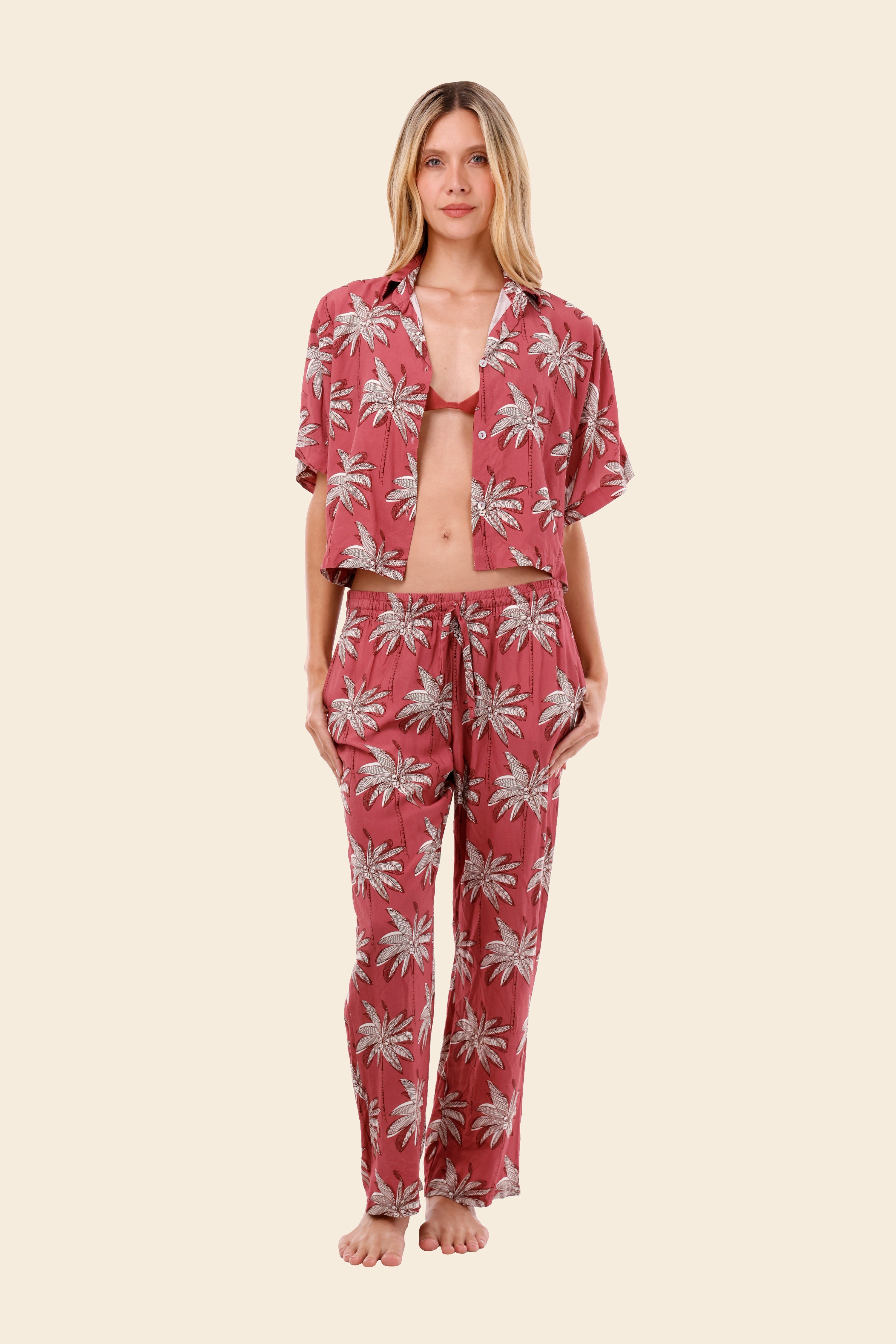 Woman wearing a pink floral womens resort wear