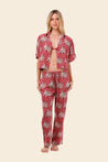 Woman wearing a pink floral womens resort wear