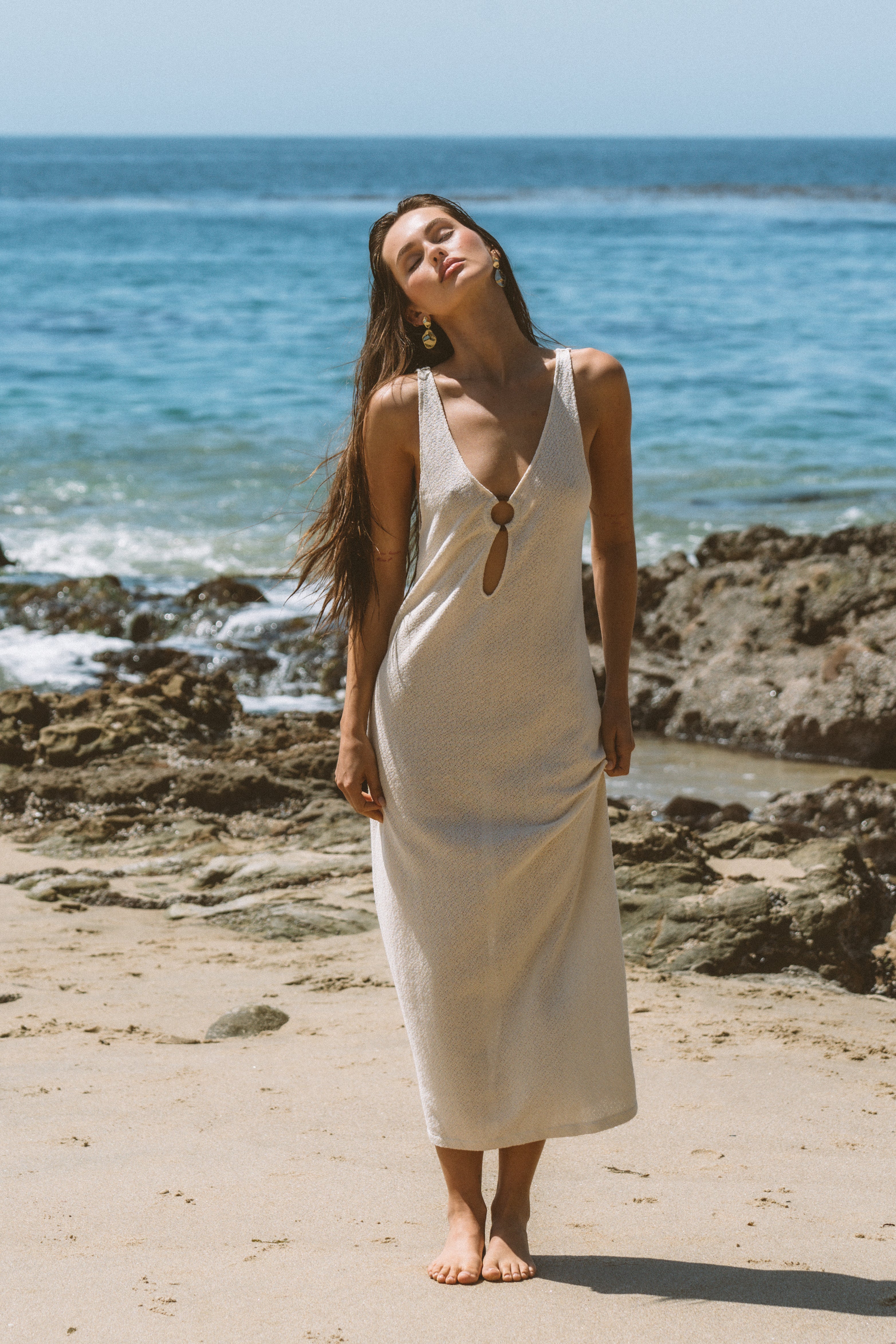 Woman wearing a white sleeveless dress