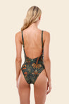 Woman wearing a patterned swimsuit 